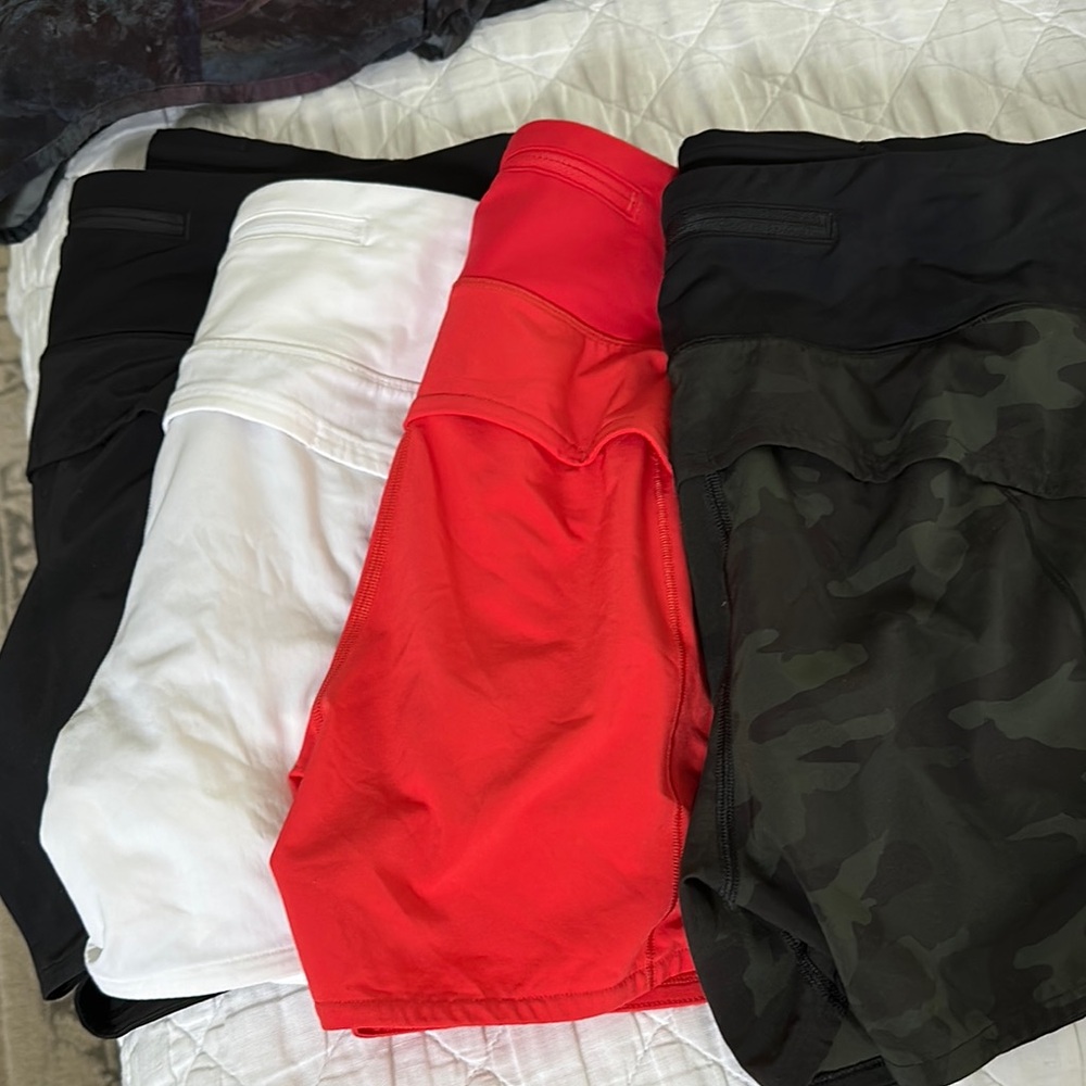 Set of Lululemon Athletic Shorts in Black, White, Red, and Camouflage